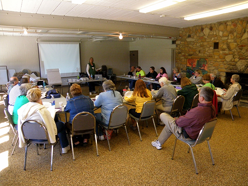 People sitting and listening at tables
