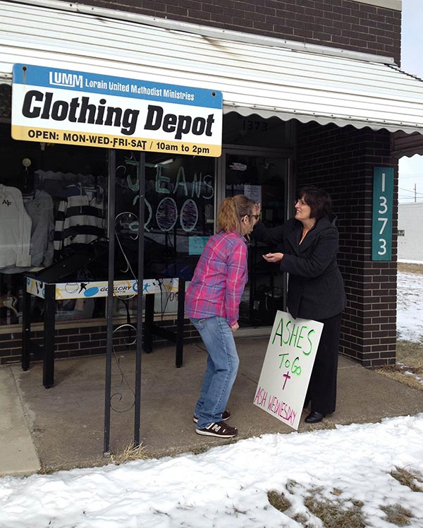 Ashes being dispensed to individual 
