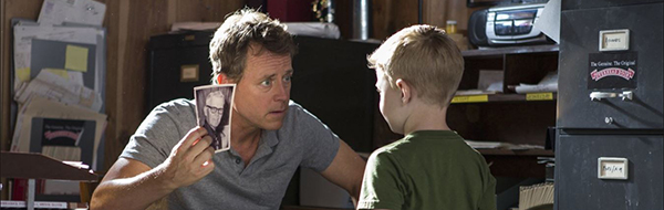 Father and son talk about the photo of grandpa