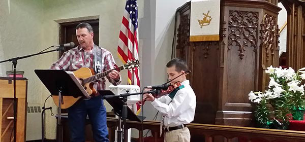 Scott and Owen playing together in church