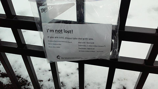 Sign attached to iron rail