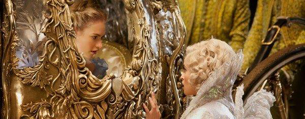 Cinderrella in pumpkin carriage talking to her fairy God-mother