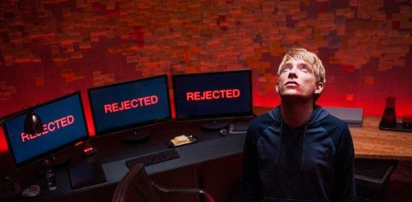 Movie image of Ex Machina - young man with blodied lip