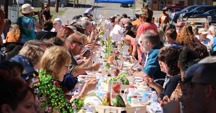 People eating at Longest talbe
