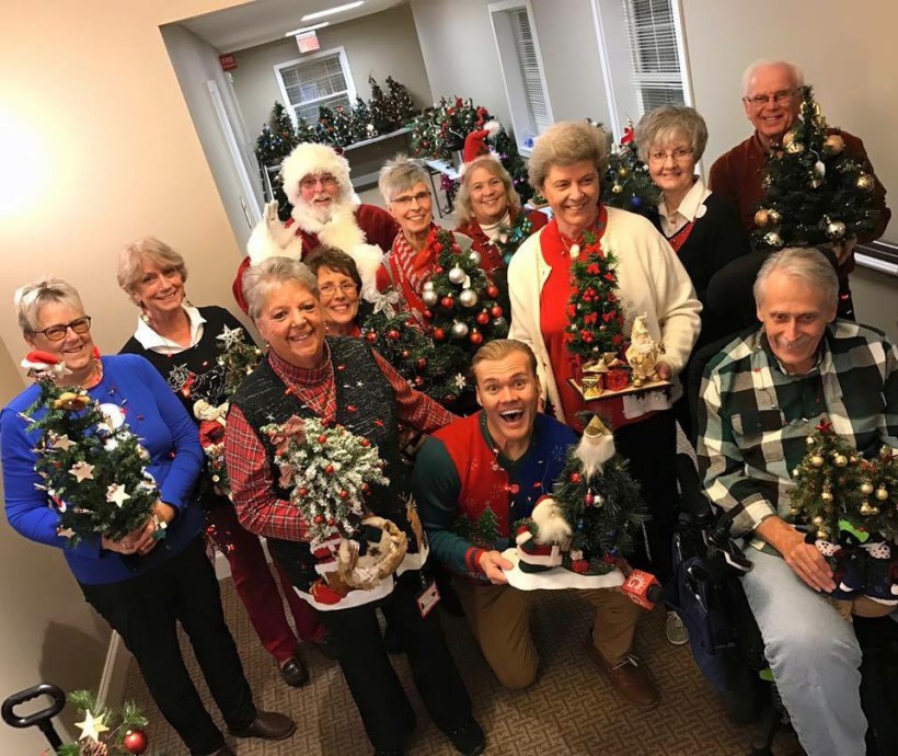 People showing off the Christmas Trees