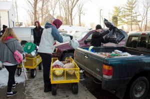 Loading up cars and trucks with Christmas goods and food