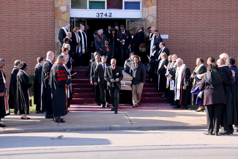 Pastors outside of church, pallbearers carry Chaffee's coffin