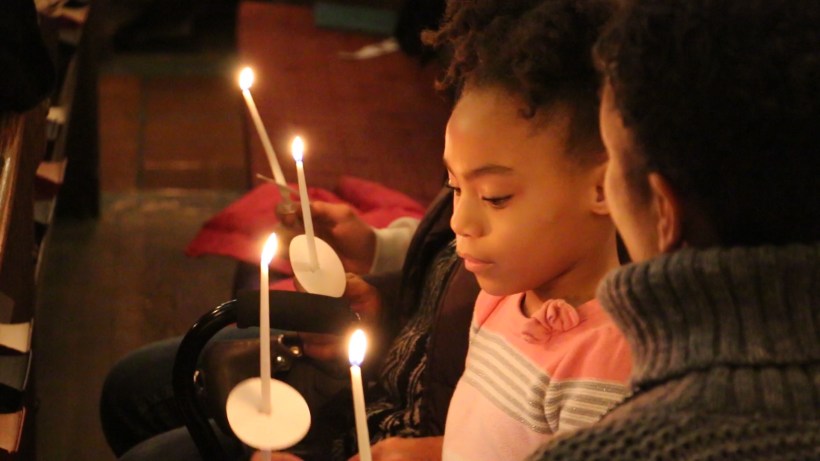 Girl lighting candles