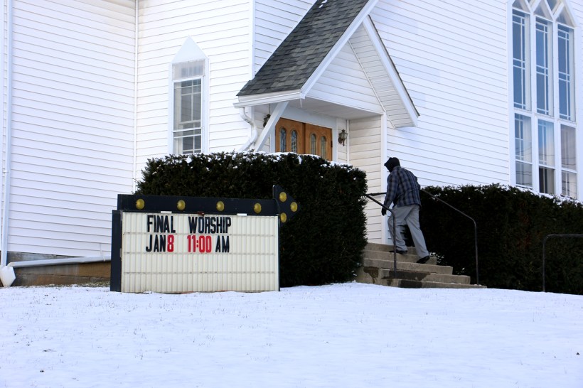 Man walking up steps to Bealsville UMC