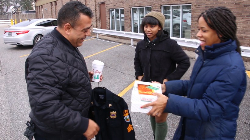 Church members give doughnuts to police officer