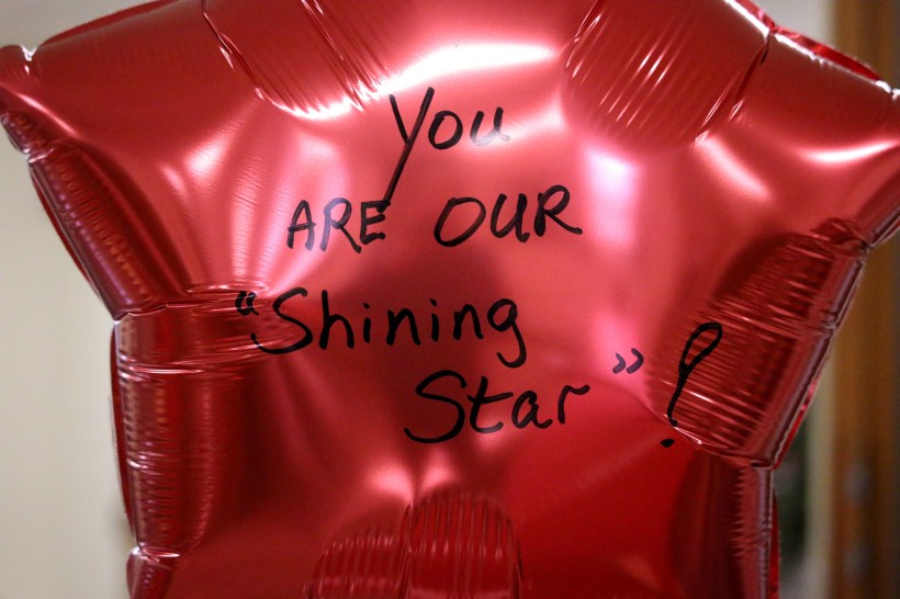 Red star ballonn - you are our shining star written on it.