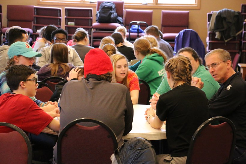 youth and leadership discuss at round tables