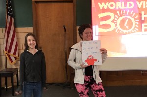 Youth holding up a sign