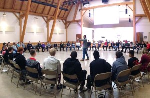 Solid Rock Retreat - Youth gathered in large circle in gym