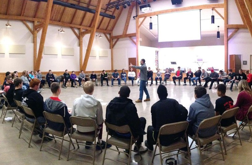Solid Rock Retreat - Youth gathered in large circle in gym