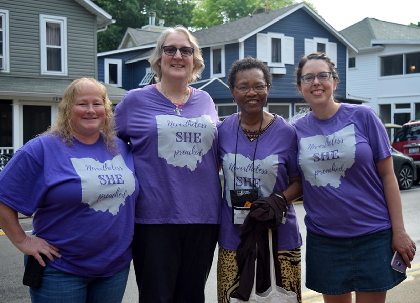 Four women wear Nevertheless, she preached t-shirts