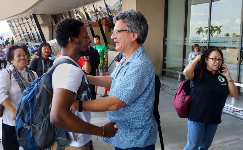 Tawanda Chandiwana greeted by Thomas Kemper, top executive of Global Ministries