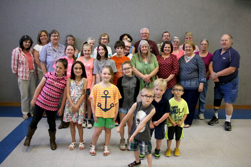 Kids and grandparents pose for group photo