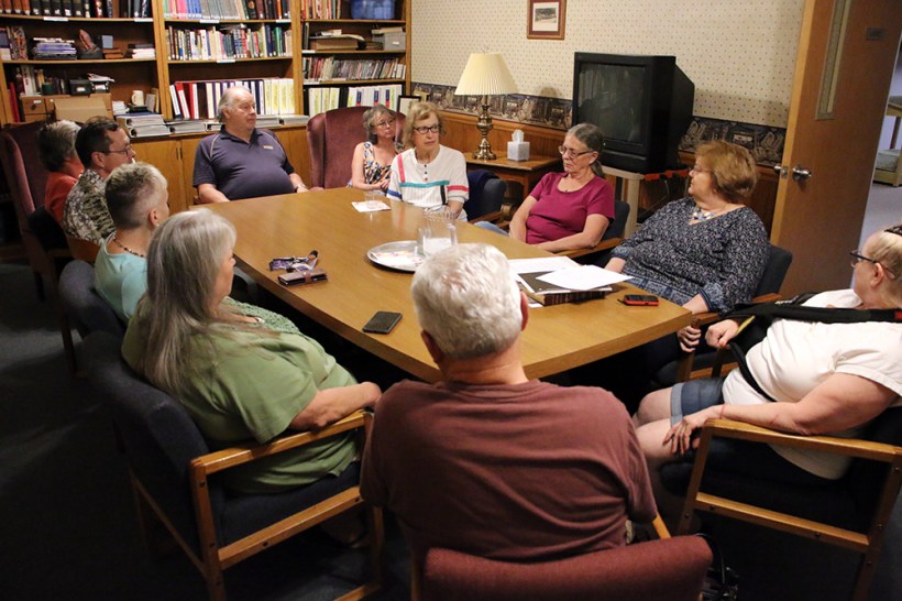 Meeting around table with grandparents and support group