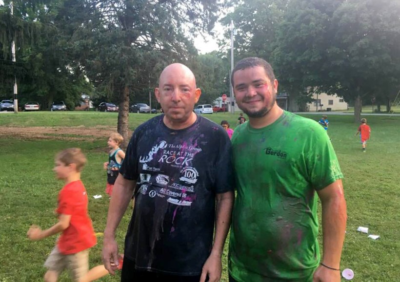 Pastor and adult get wet and dirty